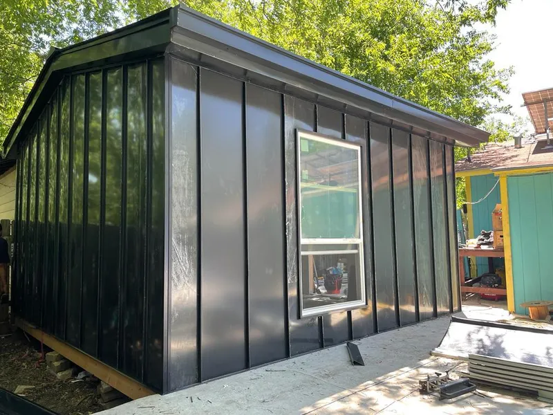 Black standing seam metal wall panels for Roof Inspection in Bettendorf