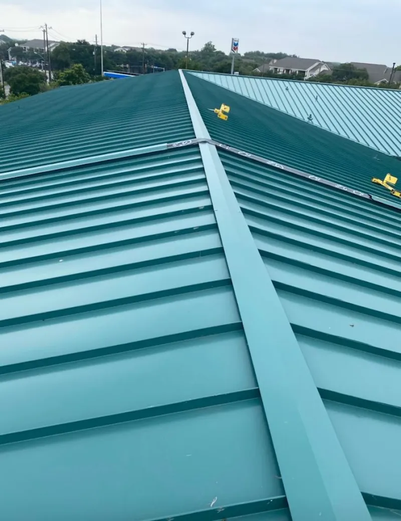 Green commercial metal roof ridge and valley for Metal Roof Repair in Bettendorf